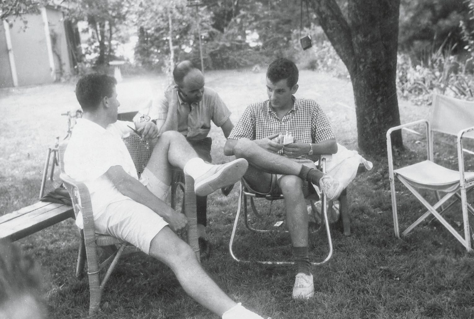 black and white photo of 3 Lessing family members seating outdoors
