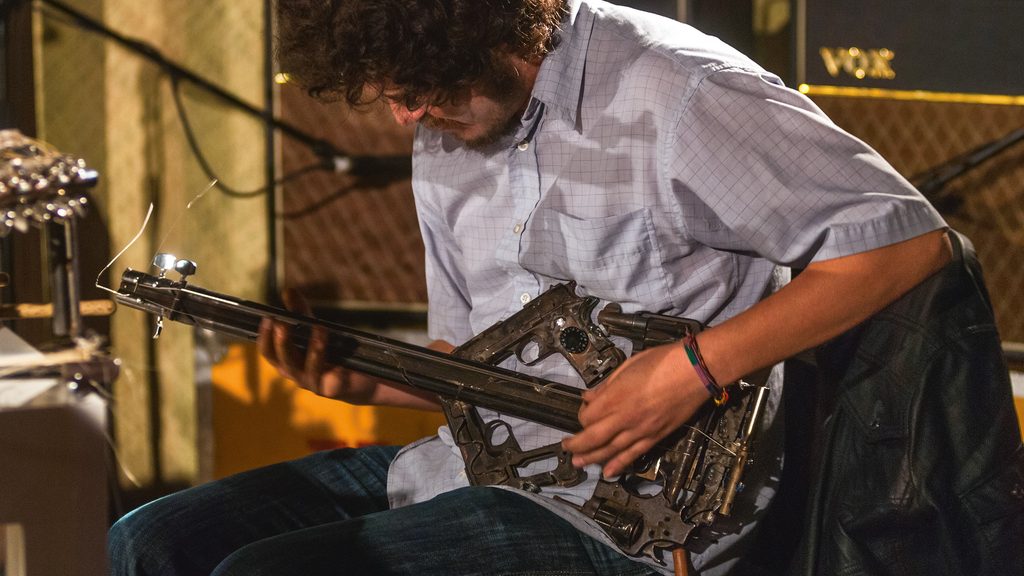 Electric guitar made from gun parts