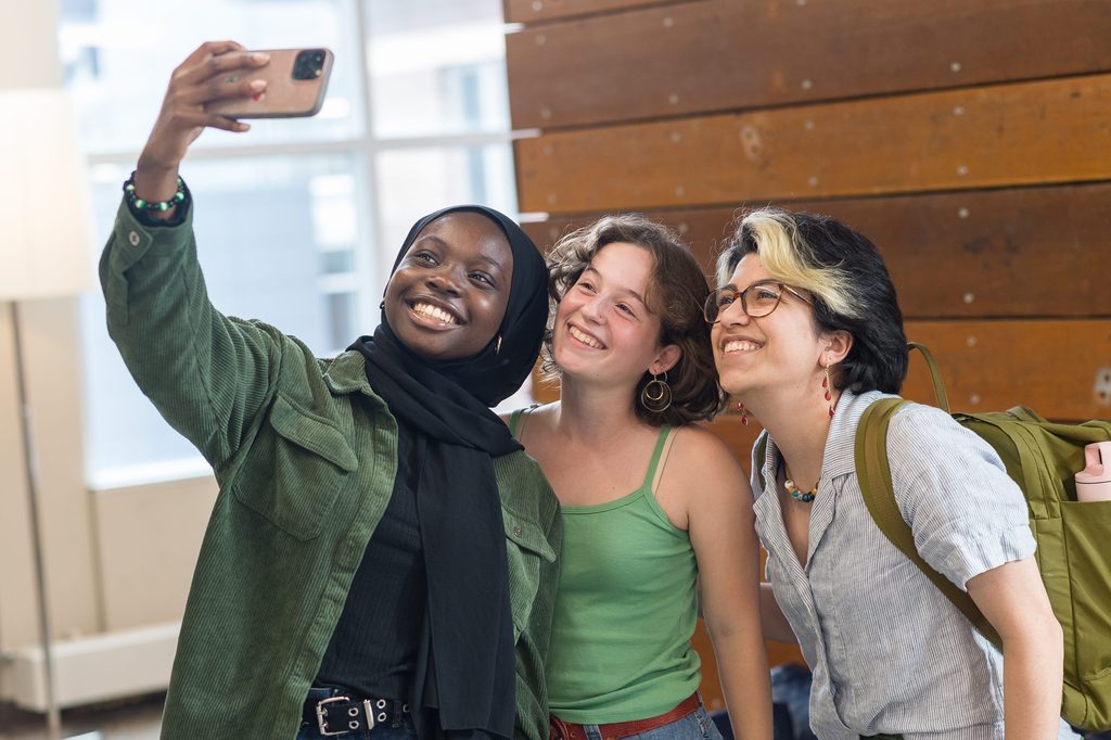 students taking selfie together
