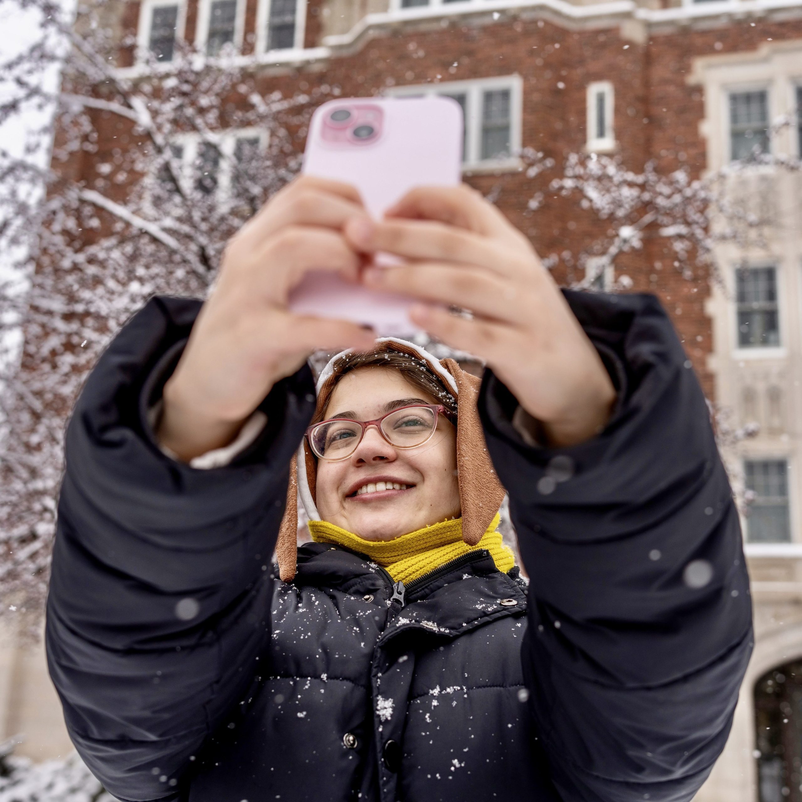 student takes a selfie in the snow