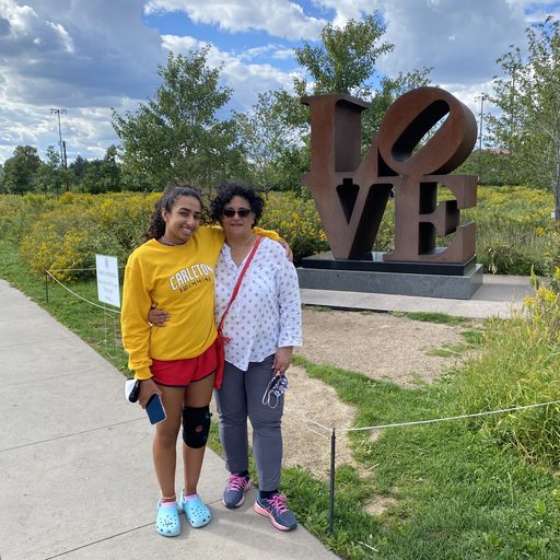 Mother and daughter in front of love statue