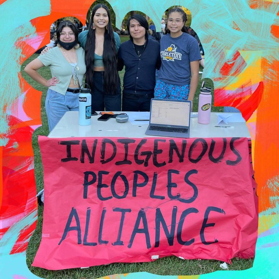 Four Indigenous students stand behind a hand-painted banner reading: Indigenous Peoples Alliance