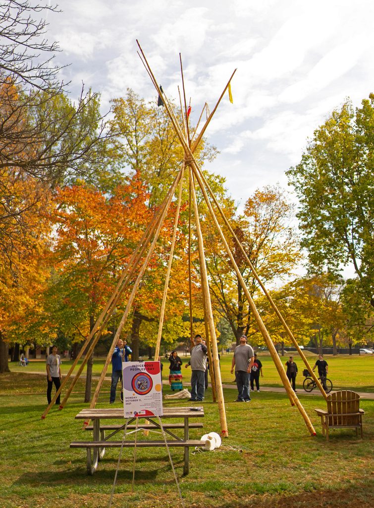 Construction of a tipi on campus for Indigenous Peoples Day, October 2021