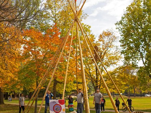 Construction of a tipi on campus for Indigenous Peoples Day, October 2021