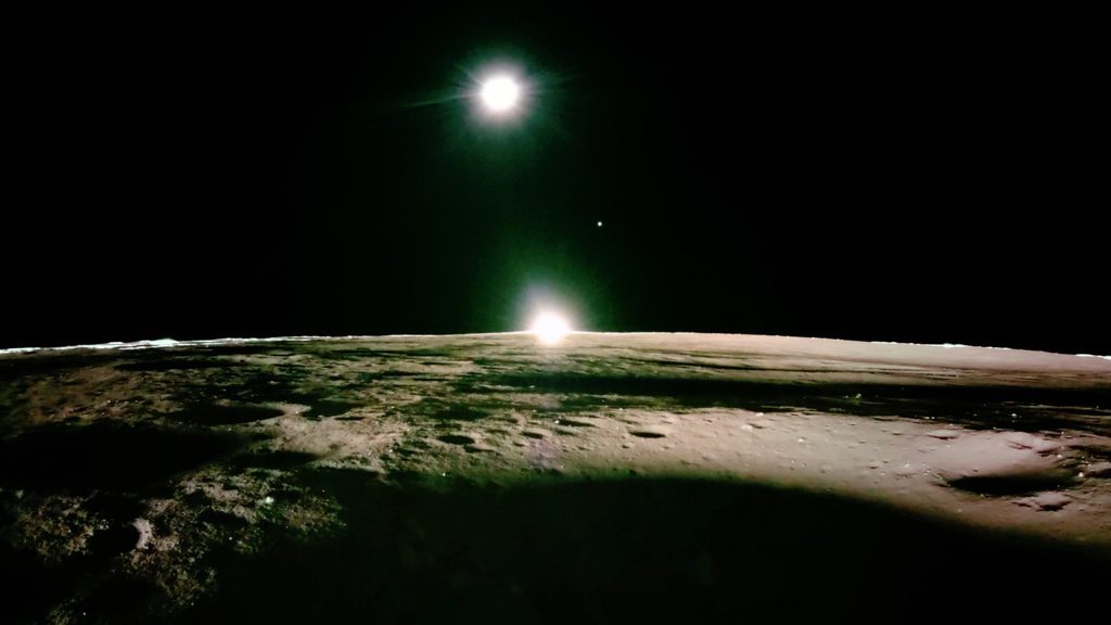 Sunset on the moon, with Earth (highest) and Venus (small starlike dot, middle)