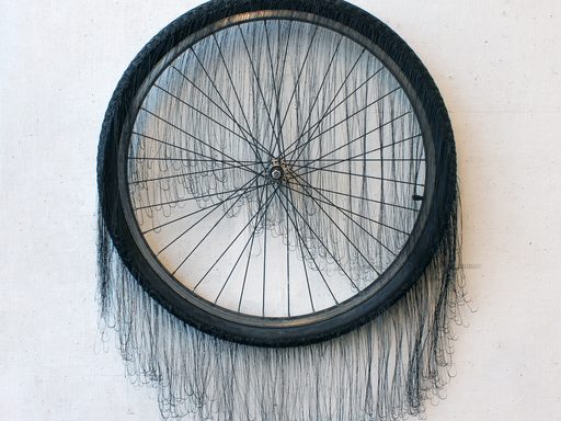 Bike wheel with string on the outside