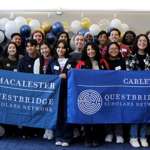 QuestBridge students holding a banner