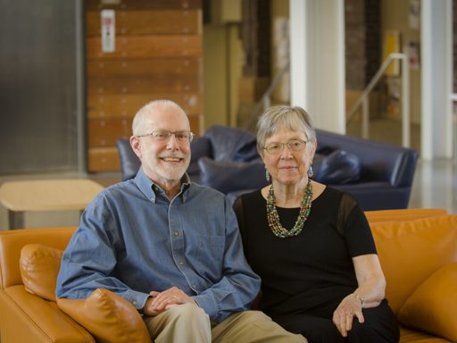 Doug and Ruth Crane seated on a couch