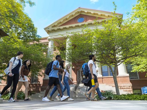 students walking outside Sayle-Hill Campus Center