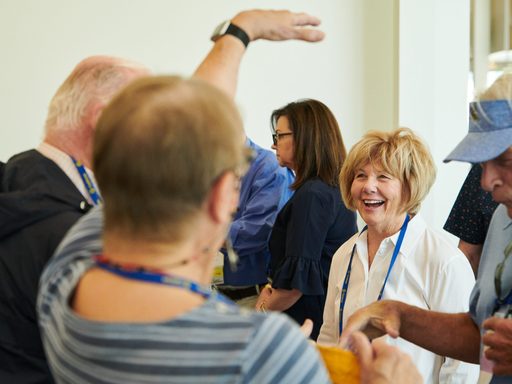 People smiling at an event