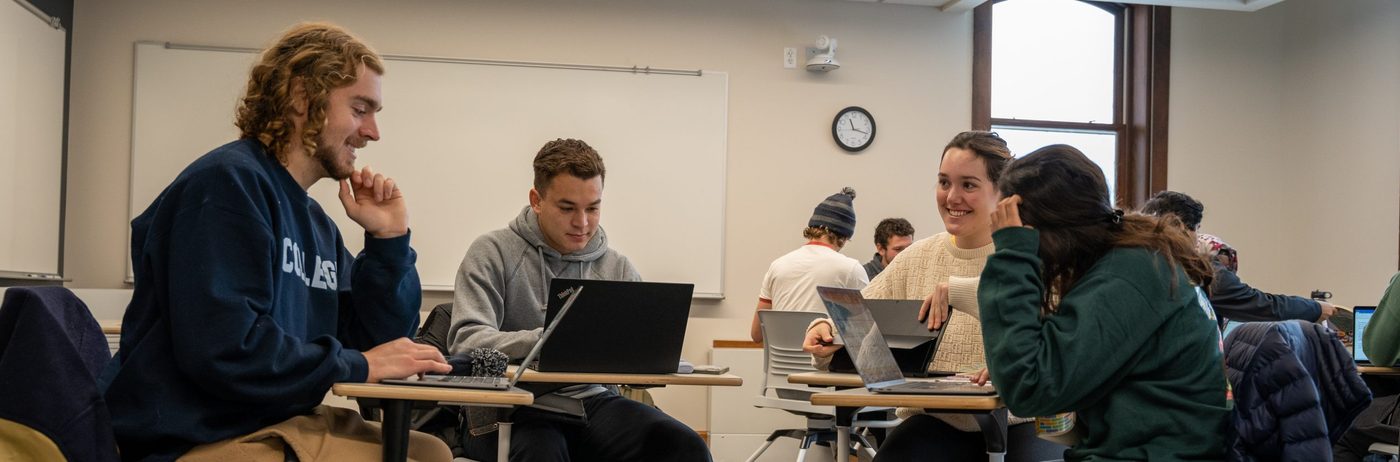 students seated in a circle in a classroom