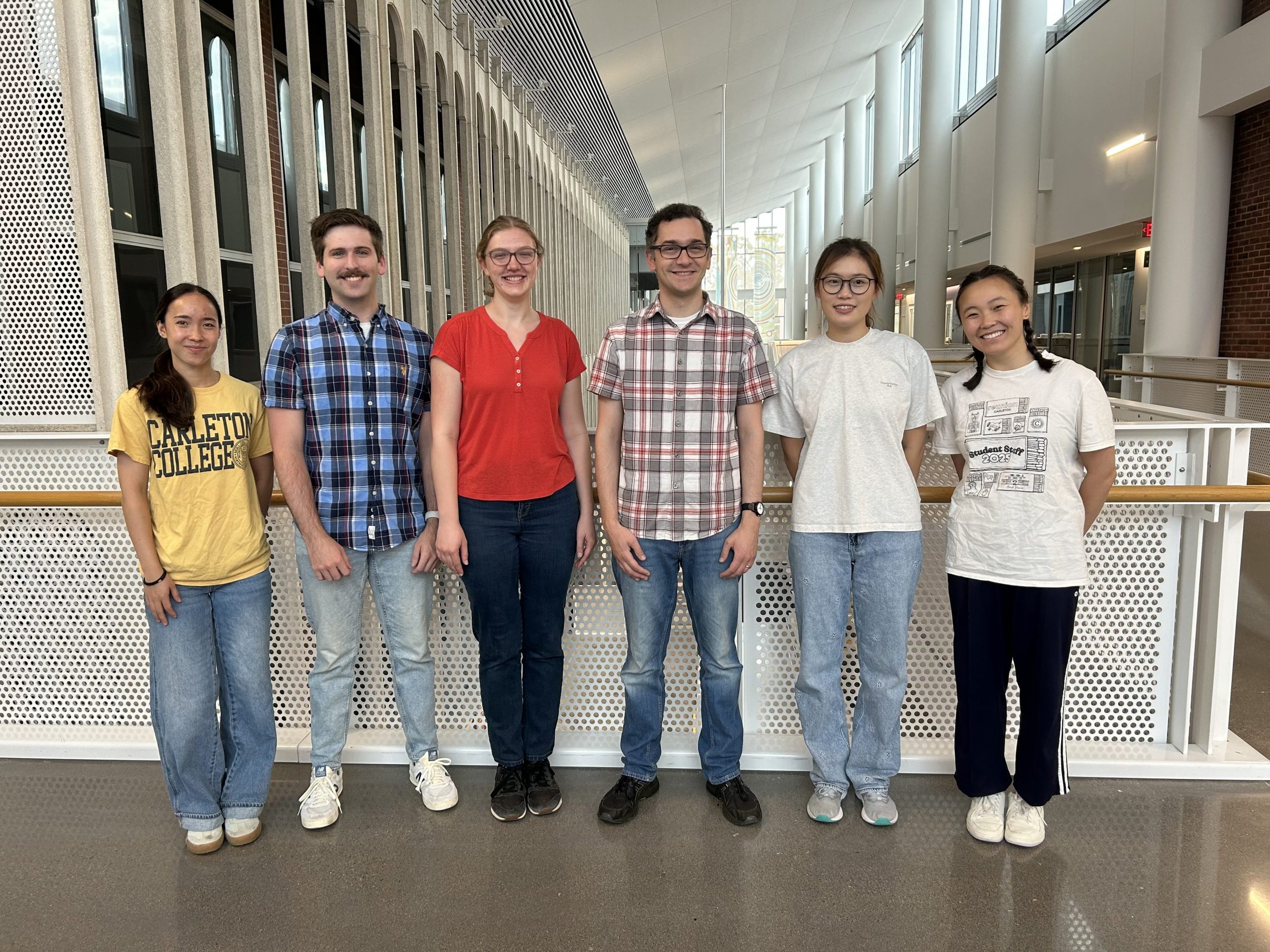 Members of the Skubi lab posing for a photo in the Anderson Atrium. From left to right: Matilda Pro, Noah Reid, Lizzy Johnstone, Kaz Skubi, Lisa Li, Zoe Morton.