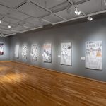 An establishing view of a gallery with wooden floors and grey walls. On the wall hang eight dye-sublimated prints on satin. Their imagery is drawn from historical newspapers, combined with the artist’s illustrations. These artworks track the rise of fascist organizations and ideologies in Minnesota in the 1930s, in particular, the pro-Nazi organization the Silver Legion of America (or Silvershirts).