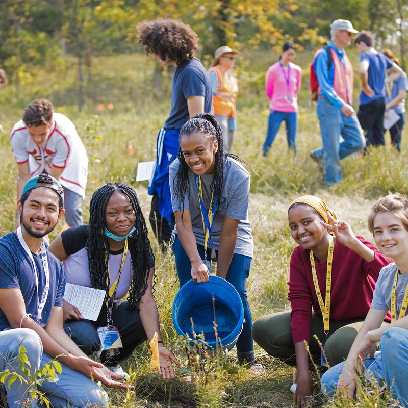 Students planting trees in the arboretum