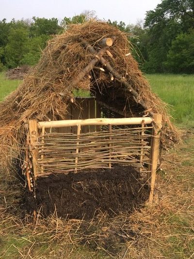 Smatt hut made of twigs and thatch with walls of wover twigs.