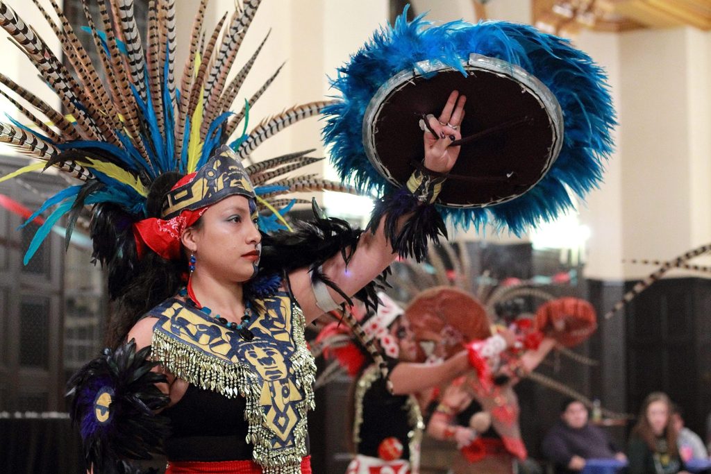 A dancer in a traditional costume at Carleton's annual Dia de los Muertos celebration