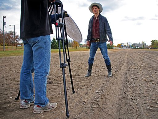 Students filming a cowboy movie outdoors