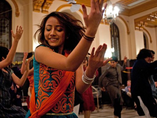 Students dance at a celebration of the Hindu festival Holi