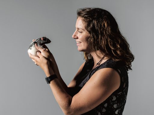 Psychology professor Sarah Meerts holds a rat