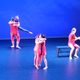 Dancers wearing red on stage