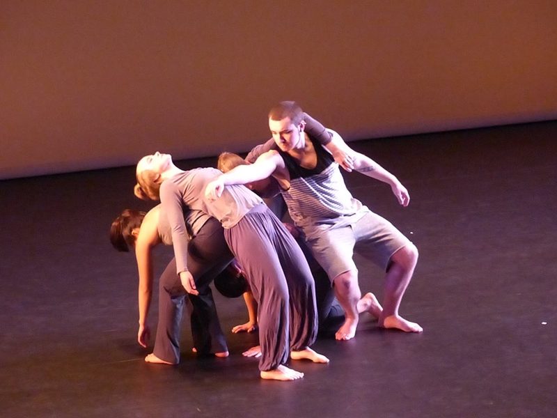 Dancers clustered together on stage