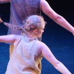 Dancers holding their arms out