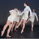 Dancers in white dresses
