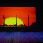 A projection of the sun on the back of the stage