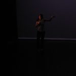 A woman dancing in the dark