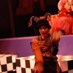 Actor wearing a hat and making a funny face during Alice in Wonderland