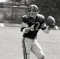 Ford runs, football in hand, looking for an open pass