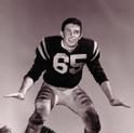 Olson poses with a wide leg stance