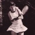 Morris Starr swings her tennis racquet during a match