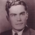 Behmler poses for a headshot with a small smile