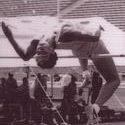 Test jumps over high jump, back bent over the bar