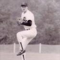 Nielson winds up to throw a baseball pitch