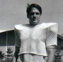 Winter poses in his football uniform in front of West Gymnasium