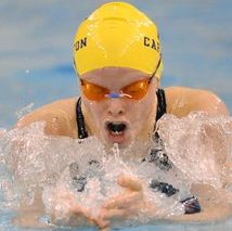 Alexander swimming breast stroke in yellow swimming cap