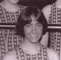 Damberg poses in a patterned swimsuit smiling