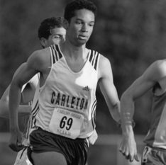 Theissen runs at an outdoor track meet