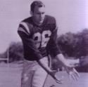 Jones runs, arms stretched low to catch the football