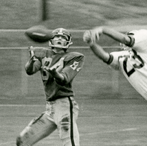 Mike Grossman facing the camera, running while catching the ball