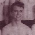 Garbisch poses smiling shirtless amongst a group