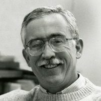 Bronner smiles towards the camera