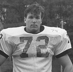 Bunnell (#72) poses with hands on hips on the football field