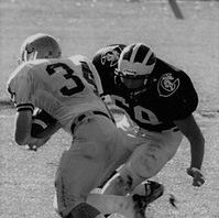 O'Reilly going for a tackle, arms outstretched