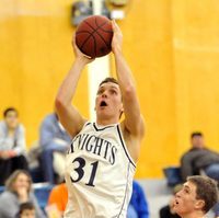 Johnson, wearing #31, jumps to make a shot holding the basketball