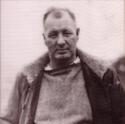 Hunt looks straight faced at the camera, hands in his jacket pockets