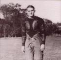 Nordly poses in football padding on the field