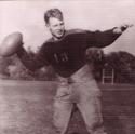 Senior winds up to throw a football